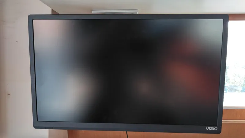 Slide: The Image of Vizio TV mounted inside a 1999 Mainship 350 Trawler boat. - 28