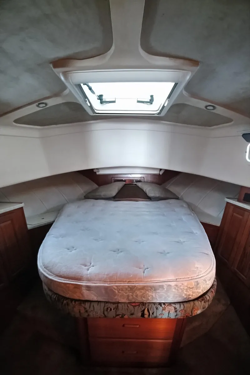 Slide: The Image of 1999 Mainship 350 Trawler cabin with bed and skylight - 31