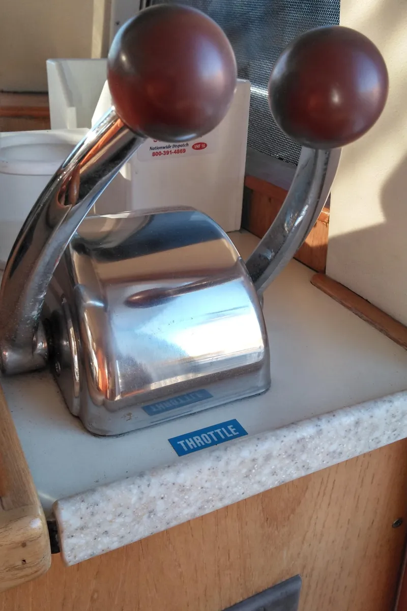 Slide: The Image of Throttle controls on a 1999 Mainship 350 Trawler boat. - 46