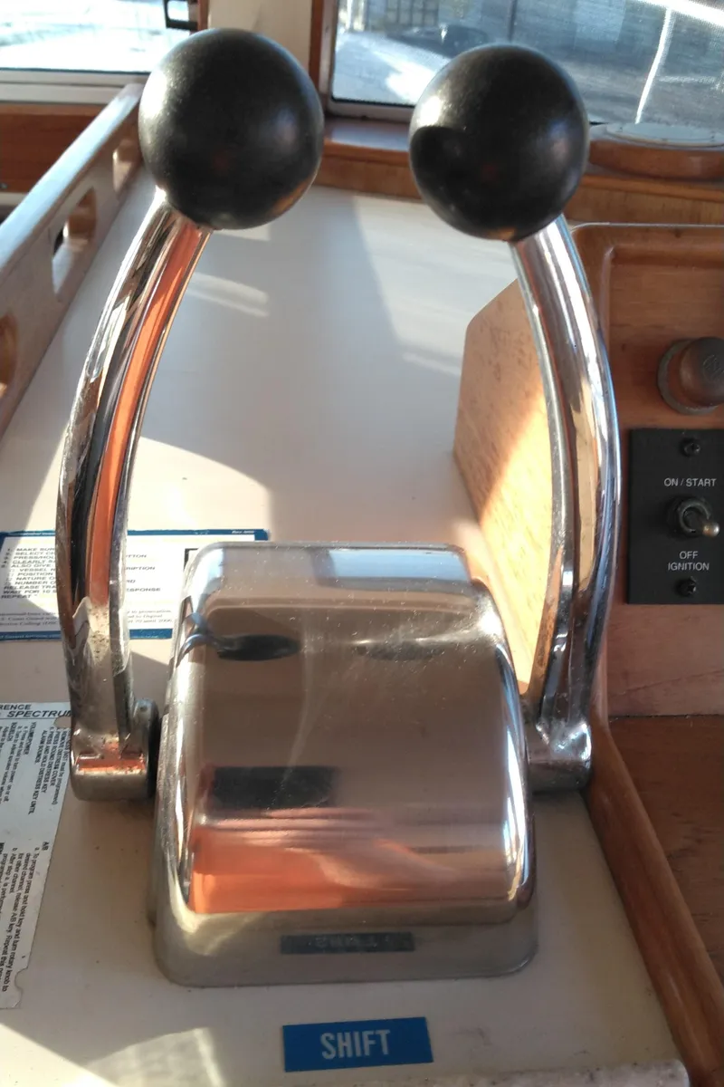 Slide: The Image of Dual throttle controls on a 1999 Mainship 350 Trawler boat. - 47