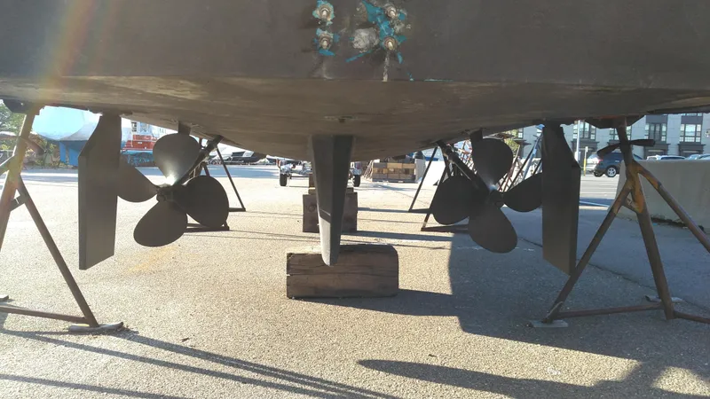 Slide: The Image of Bottom view of a 1999 Mainship 350 Trawler showing propellers and rudders. - 5
