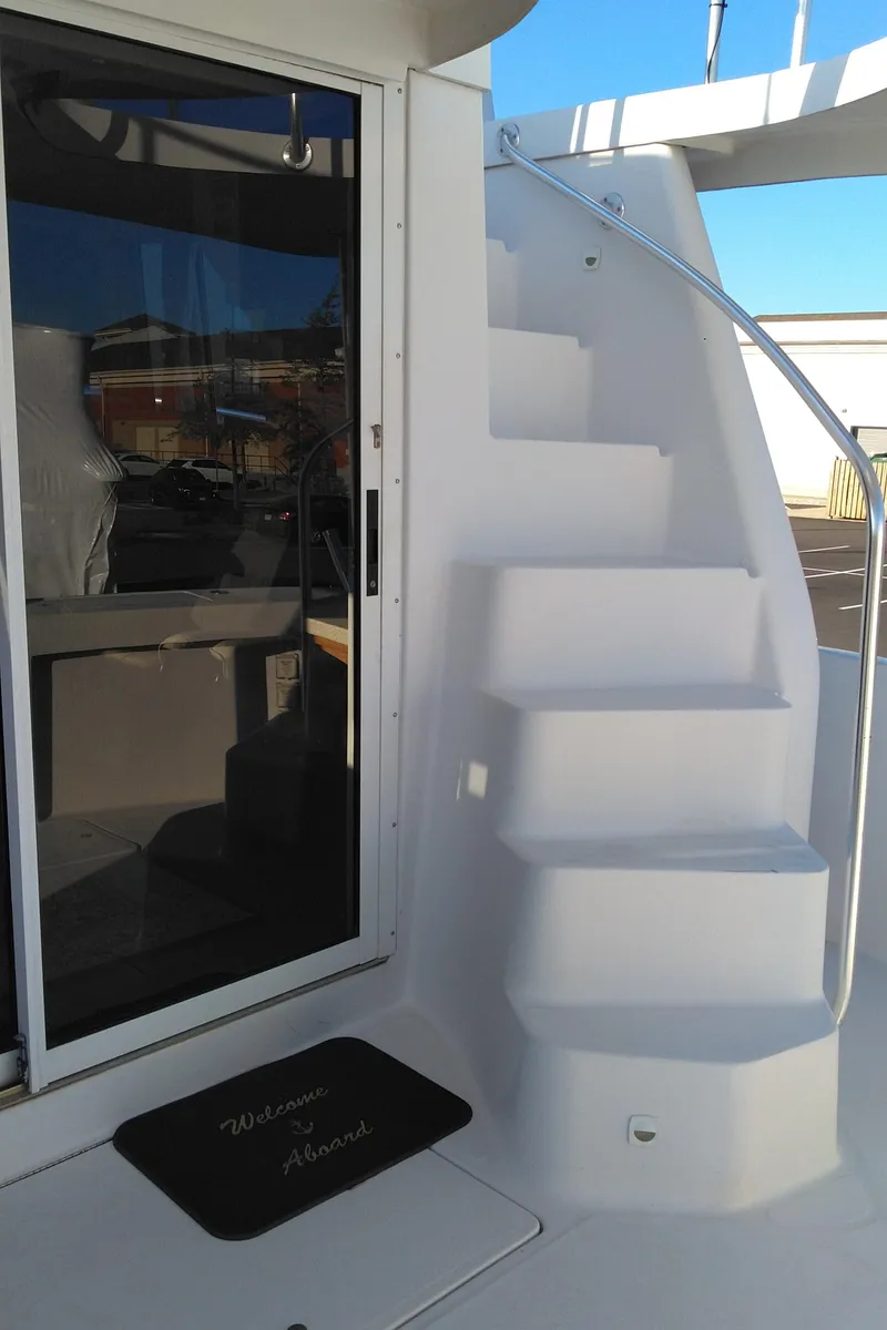 Slide: The Image of 1999 Mainship 350 Trawler with exterior stairs and sliding door. - 7