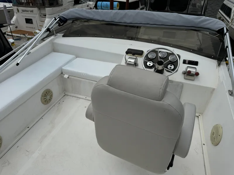 Slide: The Image of 2008 Holiday Mansion 37 boat helm with steering wheel and seating area. - 11