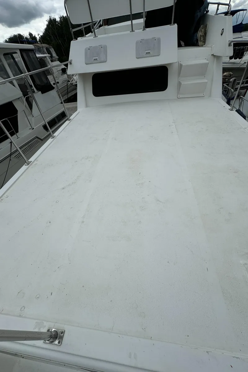 Slide: The Image of 2008 Holiday Mansion 37 boat deck, spacious and clean, with railing and steps. - 14