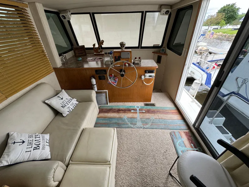 Slide: The Image of Interior of 2008 Holiday Mansion 37 houseboat with cozy seating and helm. - 17