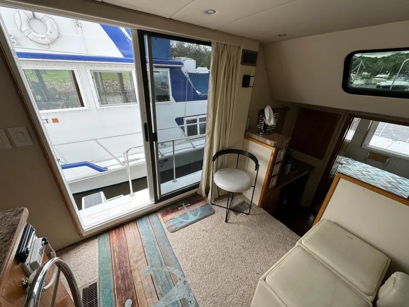 Slide: The Image of Interior view of 2008 Holiday Mansion 37 boat with sliding glass door and seating area. - 18