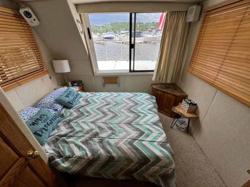 Slide: The Image of Cozy bedroom in 2008 Holiday Mansion 37 boat with waterfront view and chevron bedding. - 20