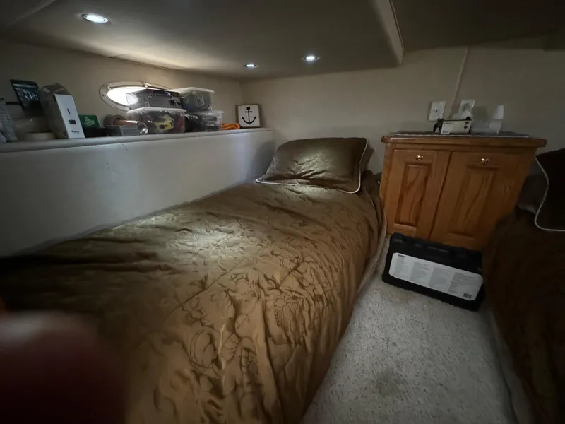 Slide: The Image of Cozy cabin interior of 2008 Holiday Mansion 37 with twin beds and wooden cabinetry. - 29