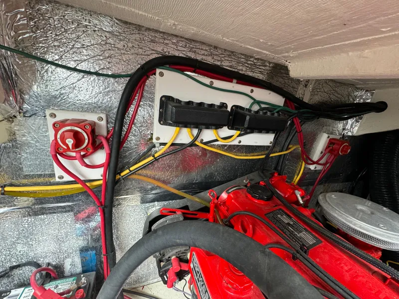 Slide: The Image of Engine compartment of a 2008 Holiday Mansion 37 with wiring and components. - 32