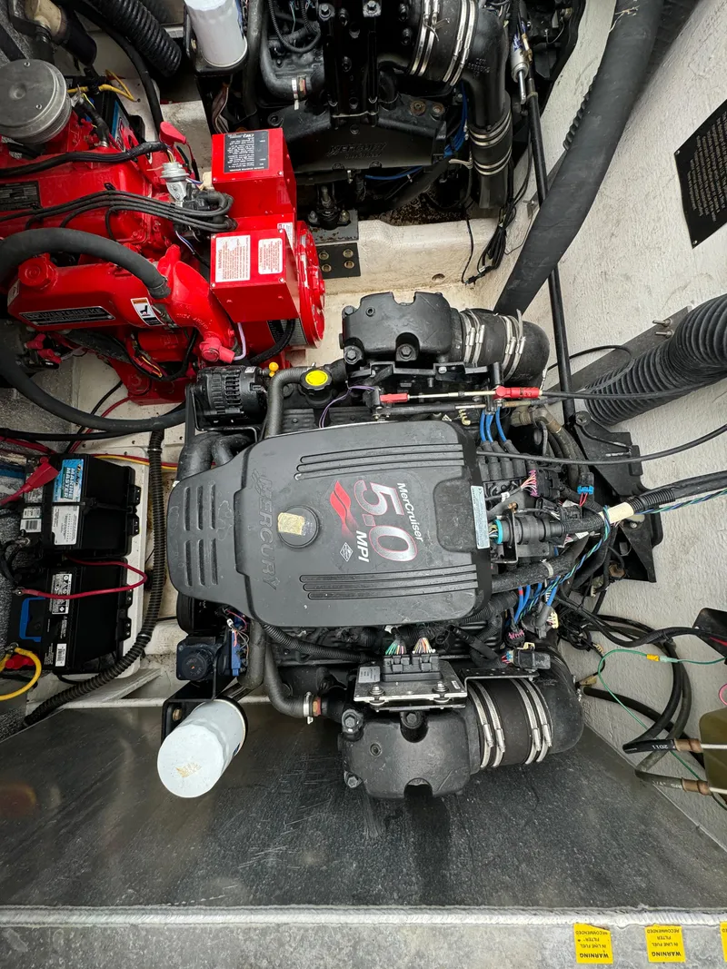 Slide: The Image of Engine compartment of a 2008 Holiday Mansion 37 boat, featuring a 5.0 engine. - 38