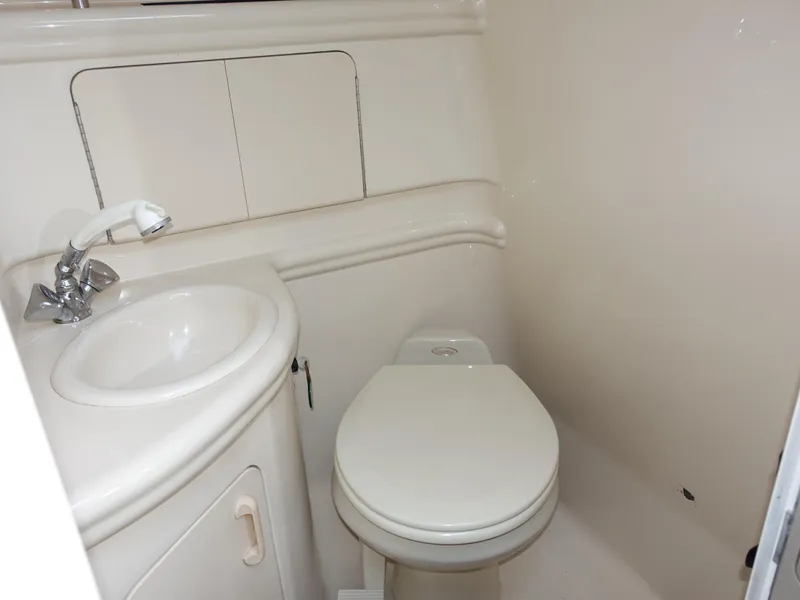 Slide: The Image of 2004 Sea Ray 280 Sundancer bathroom with sink and toilet. - 10