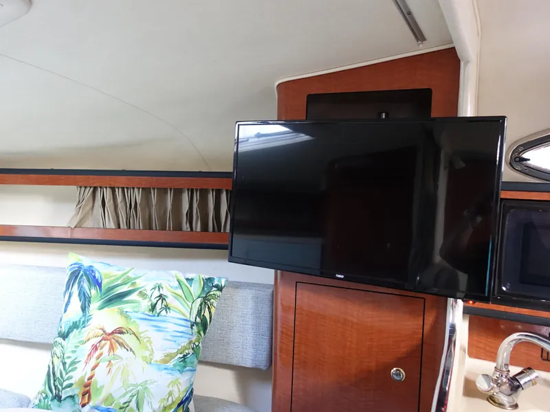 Slide: The Image of Interior of 2004 Sea Ray 280 Sundancer with TV and tropical pillow. - 14