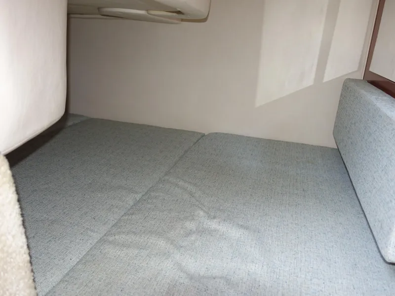 Slide: The Image of Interior cabin of 2004 Sea Ray 280 Sundancer with light gray upholstery. - 23