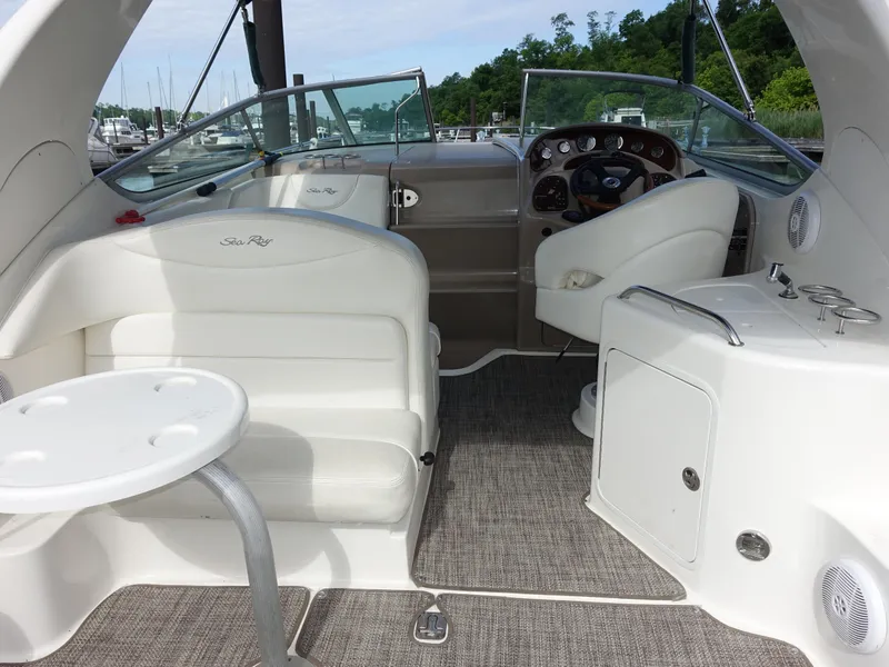 Slide: The Image of Interior of 2004 Sea Ray 280 Sundancer boat with seating and helm. - 3