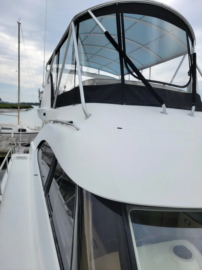 Slide: The Image of 2003 Lion Robertson & Caine Lion 46 yacht with sleek design and covered cockpit. - 15