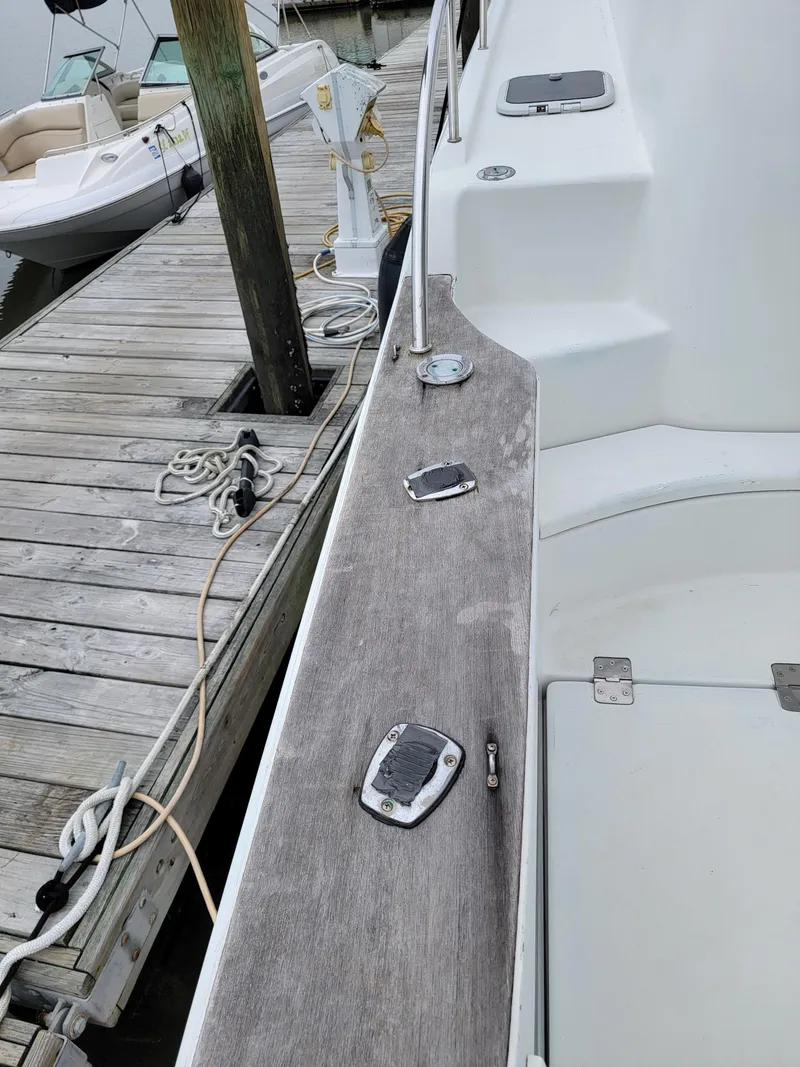 Slide: The Image of 2003 Lion Robertson & Caine Lion 46 yacht docked at marina. - 21