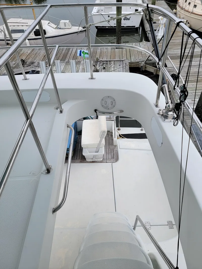 Slide: The Image of Deck view of 2003 Lion Robertson & Caine Lion 46 yacht at marina. - 23