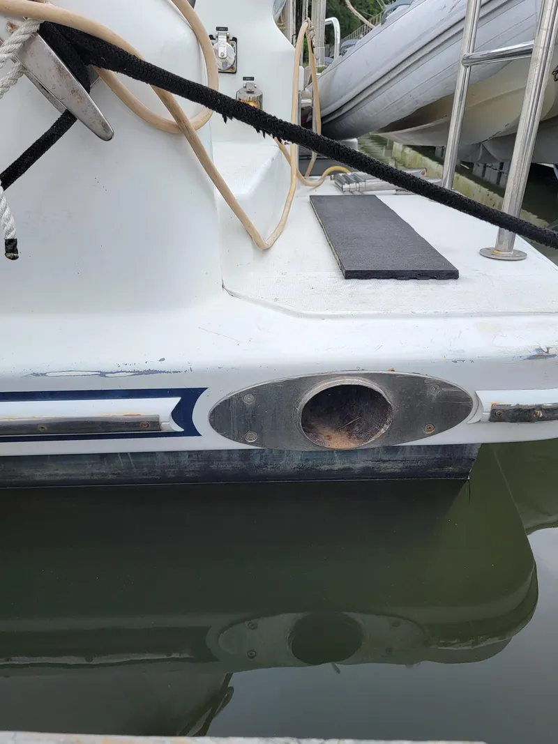 Slide: The Image of 2003 Lion Robertson & Caine Lion 46 yacht stern in marina. - 26