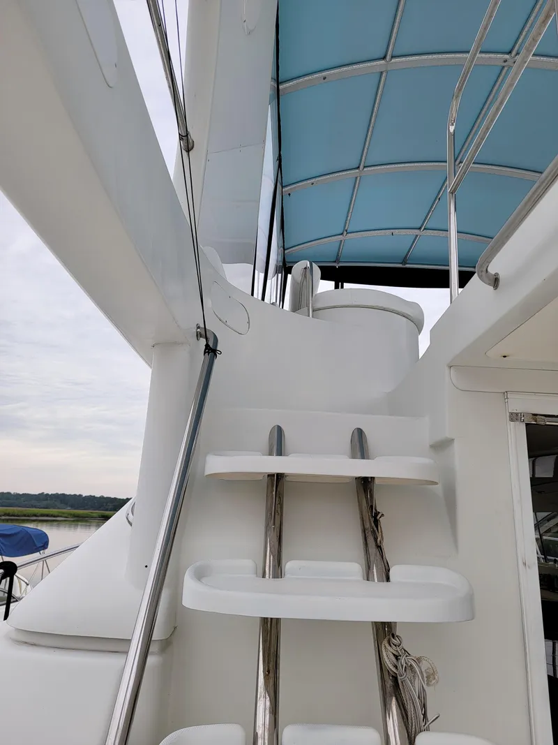 Slide: The Image of Staircase on 2003 Robertson & Caine Lion 46 yacht with blue canopy. - 30