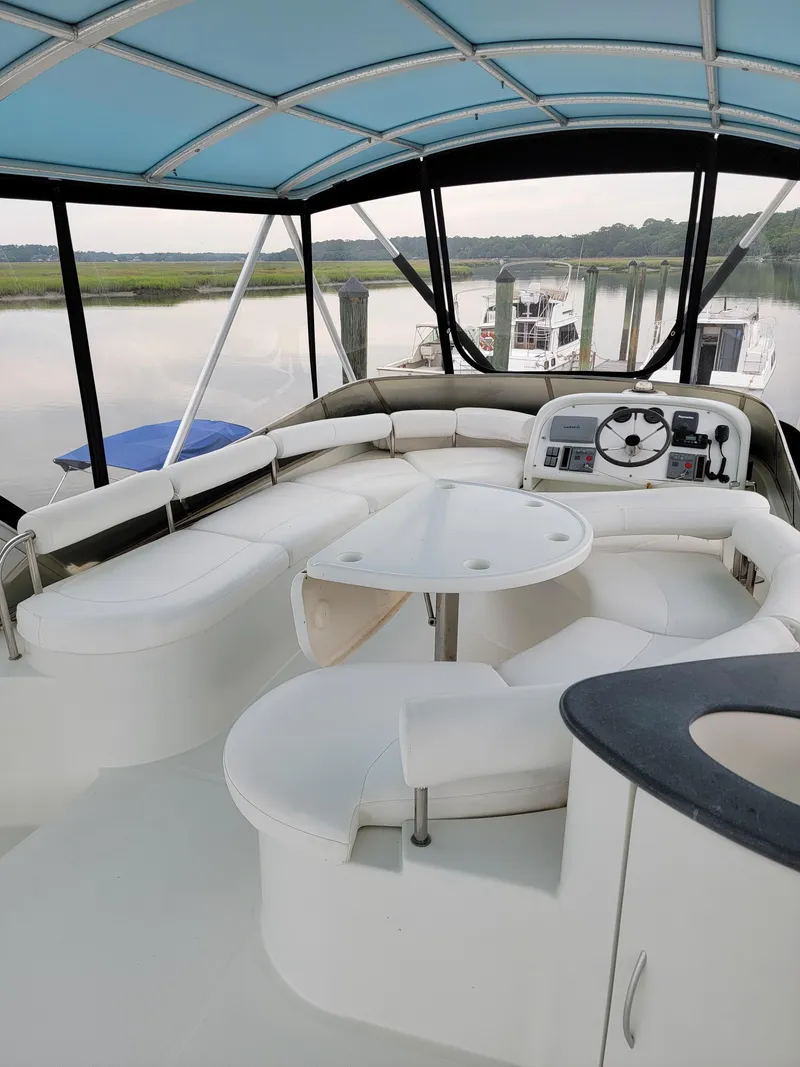 Slide: The Image of Luxurious 2003 Lion Robertson & Caine Lion 46 yacht interior with seating and helm. - 32