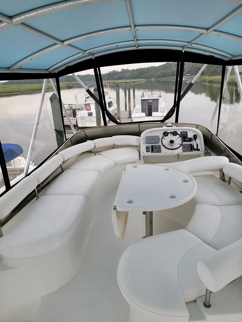Slide: The Image of 2003 Lion Robertson & Caine Lion 46 yacht interior with seating and helm. - 33
