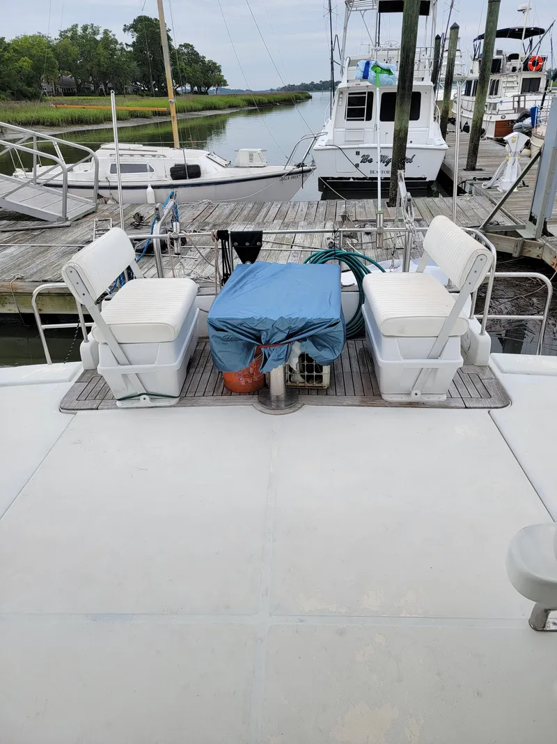 Slide: The Image of Deck view of 2003 Robertson & Caine Lion 46 catamaran at marina. - 35