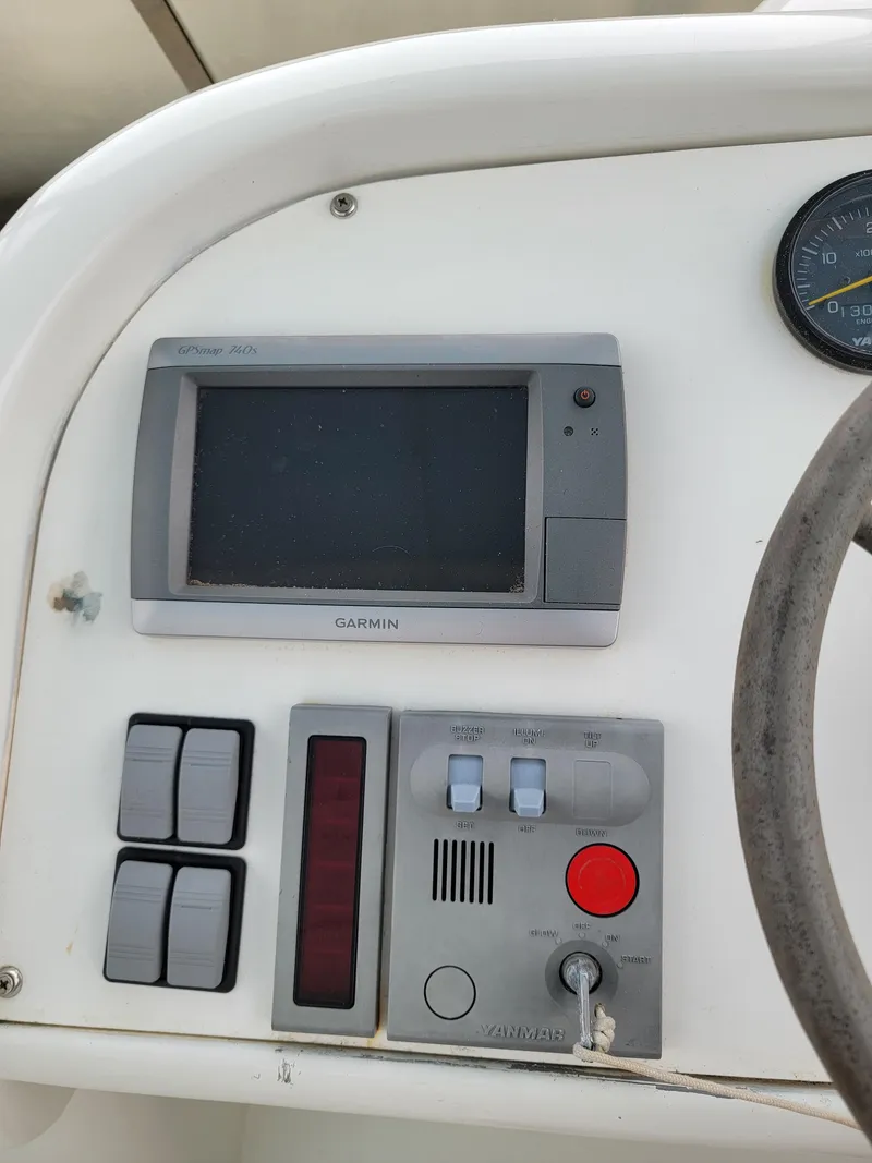 Slide: The Image of Boat control panel with Garmin display on 2003 Robertson & Caine Lion 46. - 37