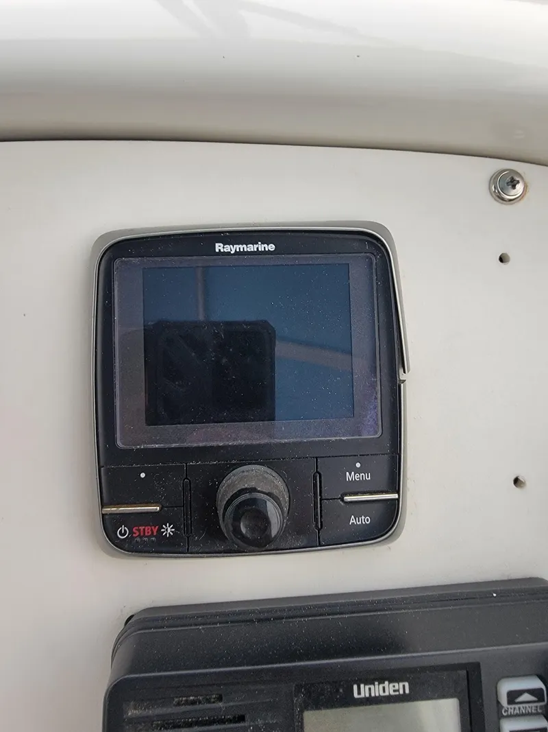Slide: The Image of Raymarine navigation system on 2003 Robertson & Caine Lion 46 yacht dashboard. - 38
