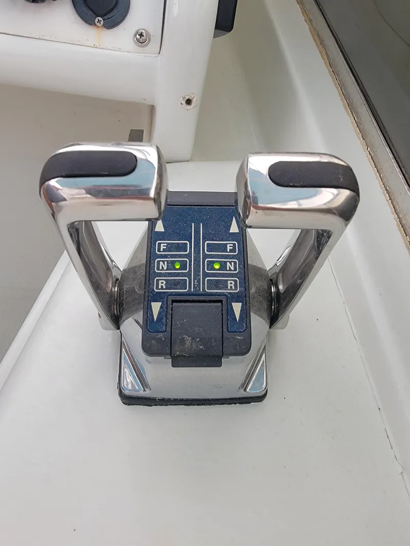 Slide: The Image of Boat throttle controls on a 2003 Robertson & Caine Lion 46 catamaran. - 39