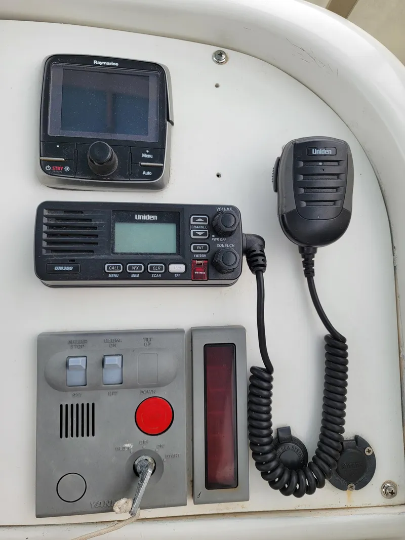 Slide: The Image of Boat control panel with radio and navigation equipment on a 2003 Robertson & Caine Lion 46. - 40