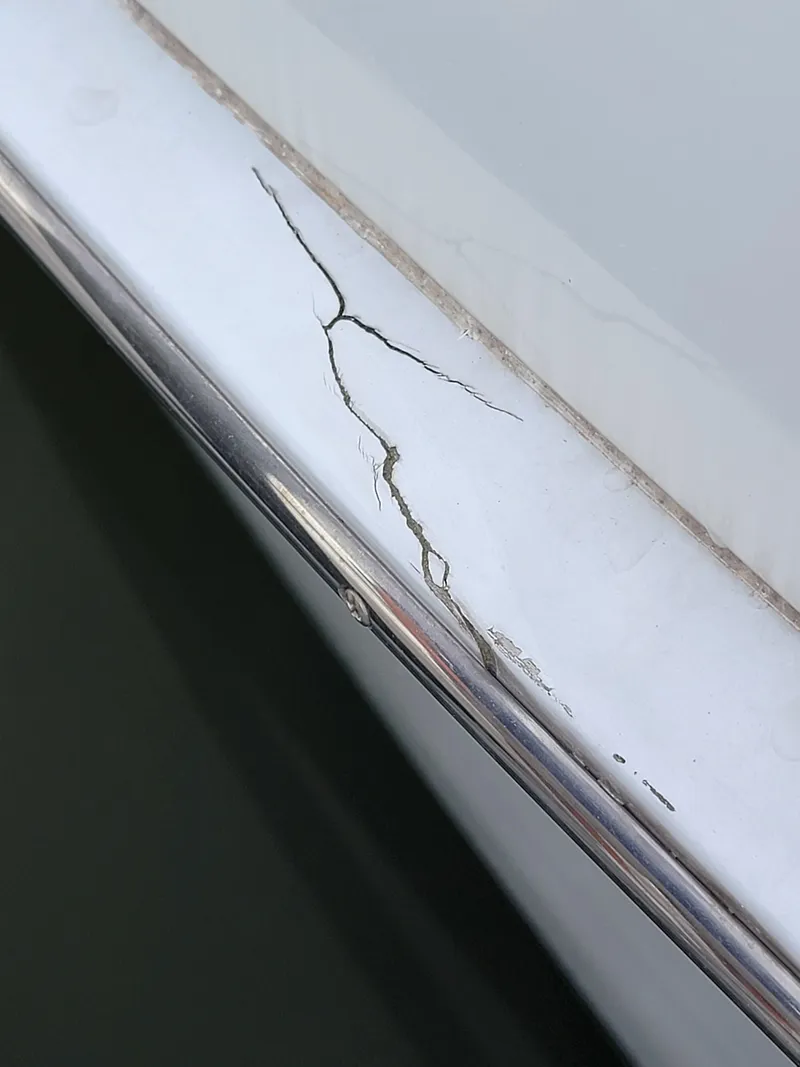 Slide: The Image of Cracked surface on 2003 Robertson & Caine Lion 46 boat. - 44
