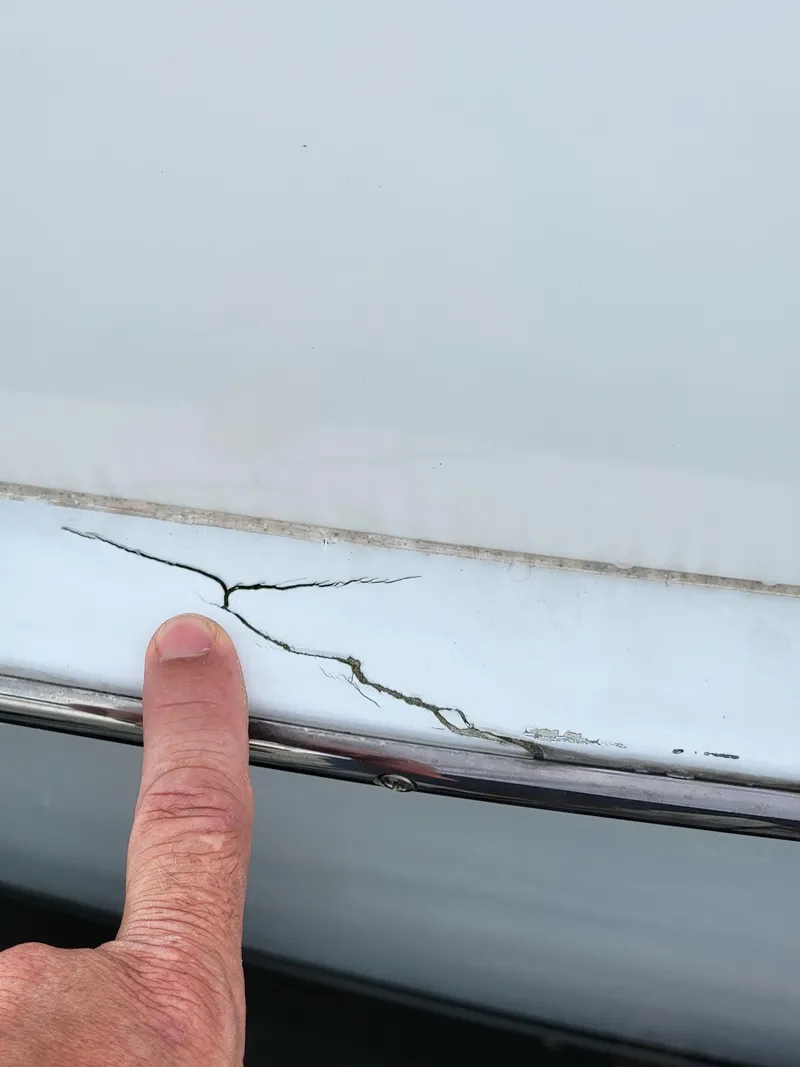 Slide: The Image of Close-up of a crack on a 2003 Robertson & Caine Lion 46 boat hull. - 45