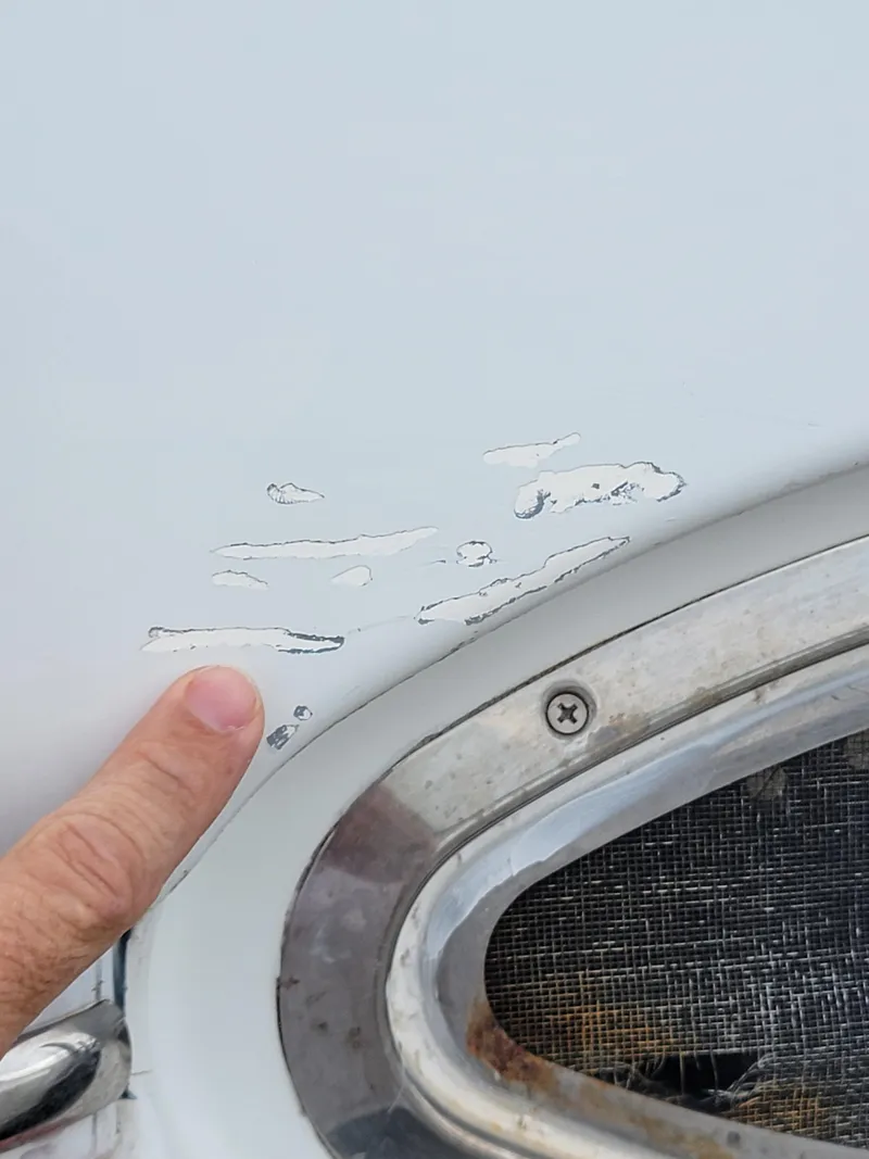 Slide: The Image of Close-up of paint damage on 2003 Lion Robertson & Caine Lion 46 boat. - 46