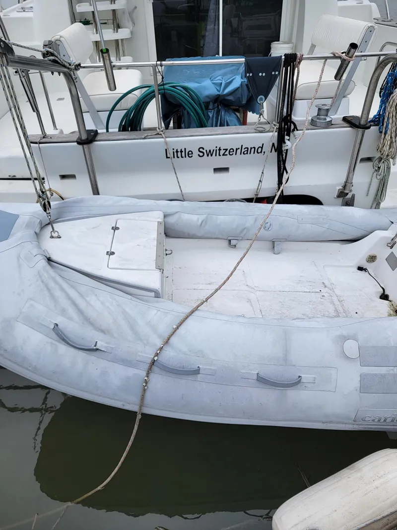 Slide: The Image of Inflatable boat docked beside 2003 Robertson & Caine Lion 46 catamaran. - 7