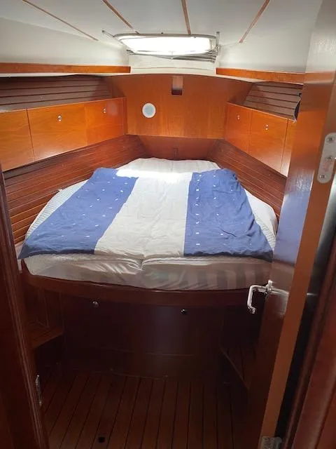 Slide: The Image of Cozy cabin interior of 2001 Beneteau Oceanis 44 CC sailboat with wooden finish. - 18