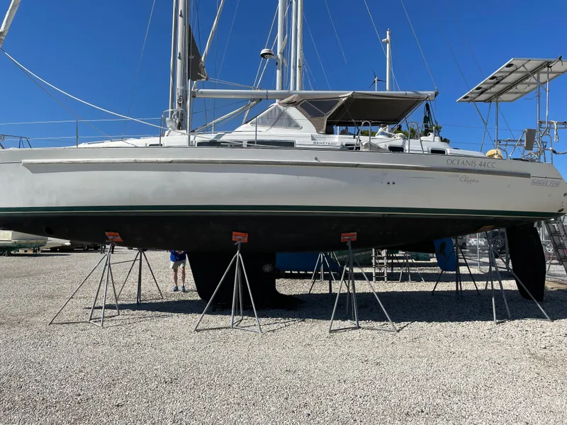 Slide: The Image of 2001 Beneteau Oceanis 44 CC sailboat on stands, displayed outdoors. - 4