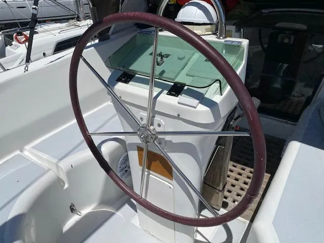 Slide: The Image of Steering wheel of a 2001 Beneteau Oceanis 44 CC sailboat cockpit. - 7