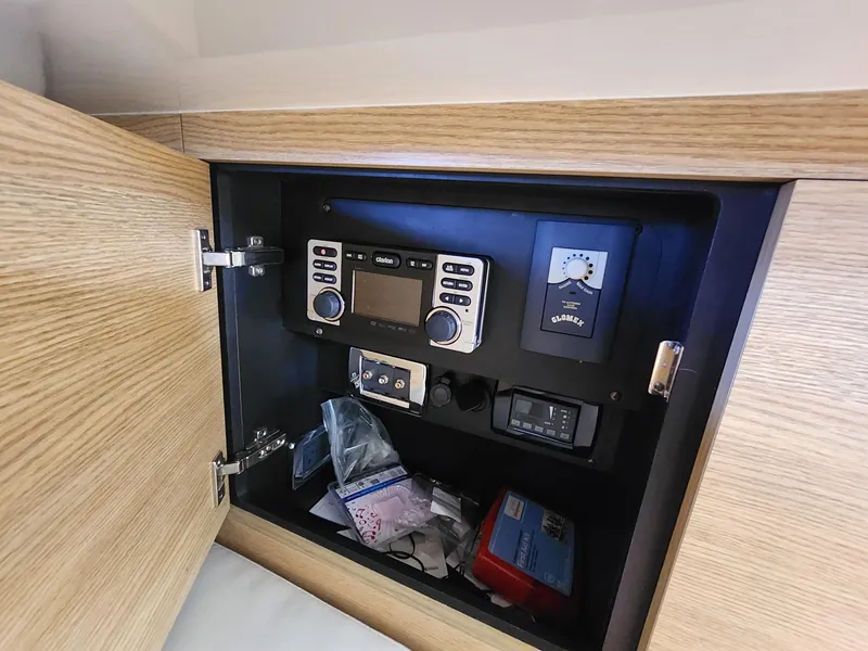 Slide: The Image of Control panel inside Chaparral 327 SSX boat cabinet, featuring various electronic devices. - 10