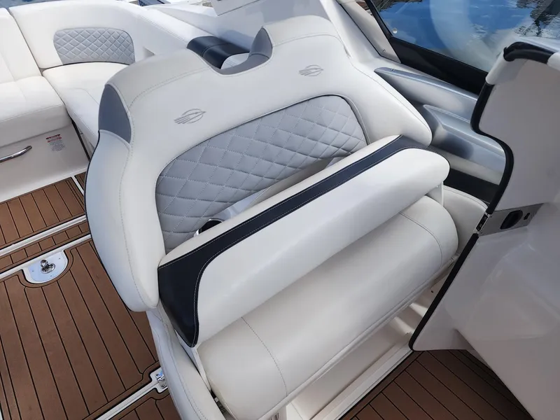 Slide: The Image of Luxury seating on 2012 Chaparral 327 SSX boat with quilted upholstery and wood flooring. - 17