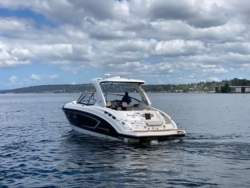 Slide: The Image of Chaparral 327 SSX 2012 boat cruising on a lake under cloudy skies. - 28