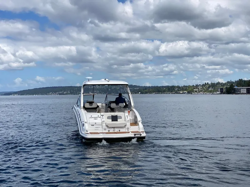 Slide: The Image of Chaparral 327 SSX 2012 boat cruising on a lake under a cloudy sky. - 29