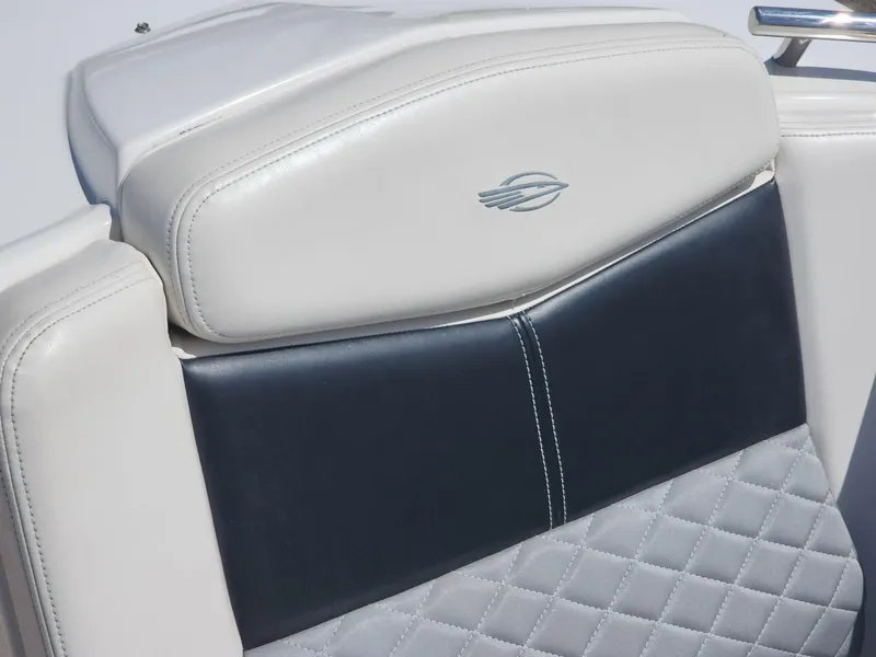 Slide: The Image of White and navy leather seat of 2012 Chaparral 327 SSX boat. - 5
