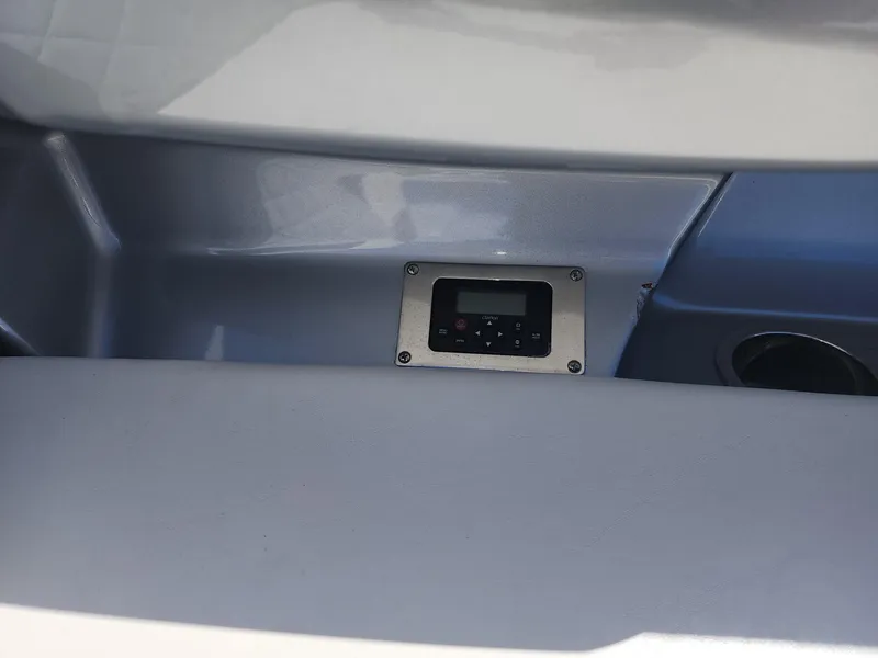 Slide: The Image of Control panel on a 2012 Chaparral 327 SSX boat interior. - 6