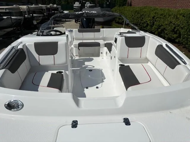 Slide: The Image of 2024 Tahoe 1950 boat interior with white and gray seating. - 6