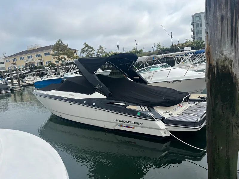 Slide: The Image of 2014 Monterey 288 SS boat docked at a marina. - 13