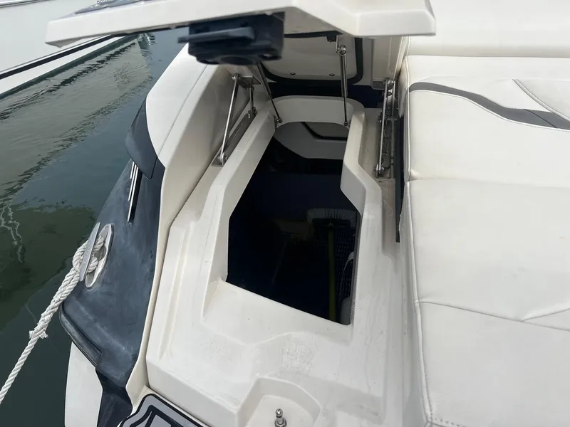 Slide: The Image of 2014 Monterey 288 SS boat with open storage compartment at the stern. - 21