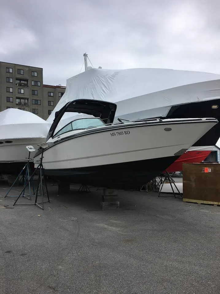 Slide: The Image of 2014 Monterey 288 SS boat on stands in a marina storage area. - 3