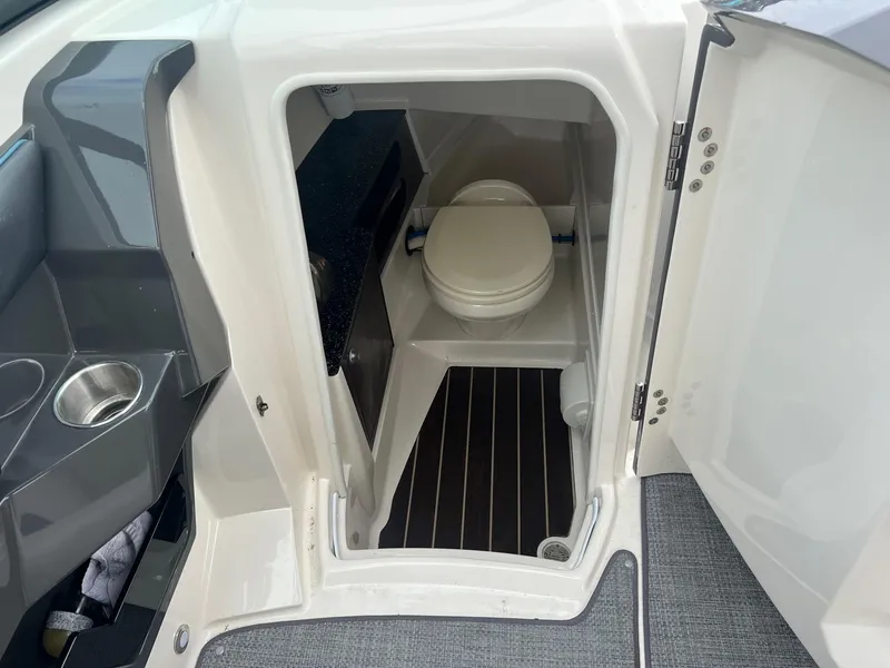 Slide: The Image of 2014 Monterey 288 SS boat interior with compact marine toilet. - 4
