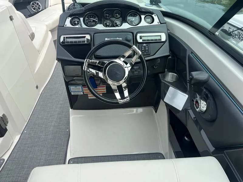 Slide: The Image of 2014 Monterey 288 SS boat cockpit with steering wheel and control panel. - 6