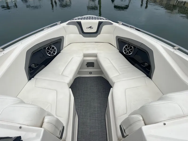 Slide: The Image of 2014 Monterey 288 SS boat with white cushioned seating and built-in speakers. - 7